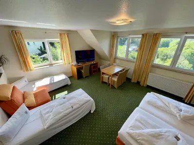 Ein Bett oder Betten in einem Zimmer der Unterkunft Berggasthof Hotel Igelwirt