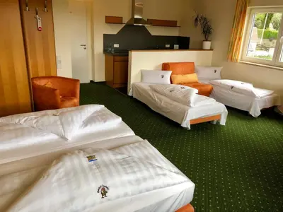 Ein Bett oder Betten in einem Zimmer der Unterkunft Berggasthof Hotel Igelwirt