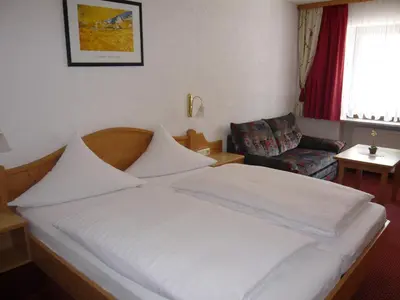 Ein Bett oder Betten in einem Zimmer der Unterkunft Hotel Pension Fleischmann