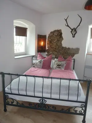 Ein Bett oder Betten in einem Zimmer der Unterkunft Fahrenbach-Alm