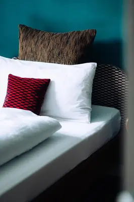 Ein Bett oder Betten in einem Zimmer der Unterkunft Molo Rouge - Boutiquehotel & Café