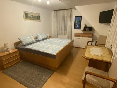 Ein Bett oder Betten in einem Zimmer der Unterkunft Gästehaus Frankenhof