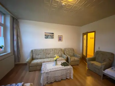 Ein Sitzbereich in der Unterkunft Ferienwohnung Goldener Drache