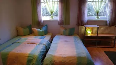 Ein Bett oder Betten in einem Zimmer der Unterkunft Ferienwohnung Steinwald Ausläufer mit Blick auf Kösseine