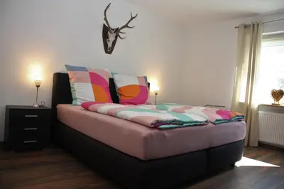 Ein Bett oder Betten in einem Zimmer der Unterkunft Feriendomizil Fichtelherz