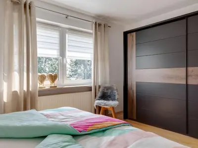 Ein Bett oder Betten in einem Zimmer der Unterkunft Feriendomizil Fichtelherz