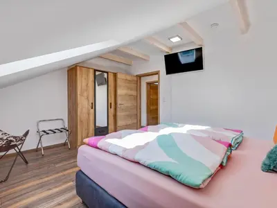 Ein Bett oder Betten in einem Zimmer der Unterkunft Feriendomizil Fichtelherz