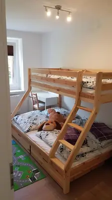 Ein Bett oder Betten in einem Zimmer der Unterkunft MaPaMaJo Home Base - Familienunterkunft mit Sauna