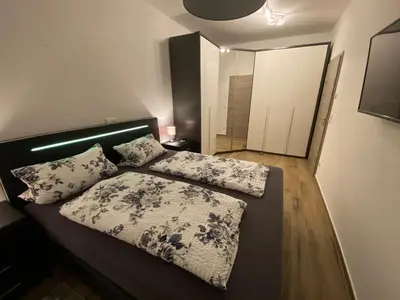 Ein Bett oder Betten in einem Zimmer der Unterkunft Gästehaus Reiger