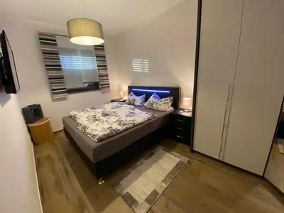 Ein Bett oder Betten in einem Zimmer der Unterkunft Gästehaus Reiger