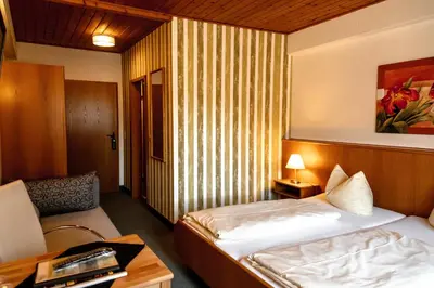 Ein Bett oder Betten in einem Zimmer der Unterkunft Gasthof Roseneck