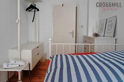 Ein Bett oder Betten in einem Zimmer der Unterkunft CROSSHILL Appartements - Charmante und helle Wohnung
