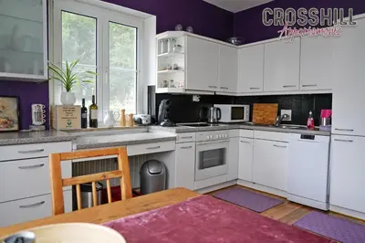 Küche/Küchenzeile in der Unterkunft CROSSHILL Appartements - Charmante und helle Wohnung