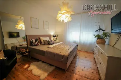 Ein Bett oder Betten in einem Zimmer der Unterkunft CROSSHILL Appartements - Charmante und helle Wohnung