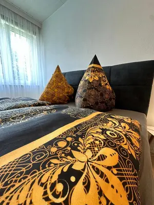 Ein Bett oder Betten in einem Zimmer der Unterkunft Gemütliches Appartement - WBS