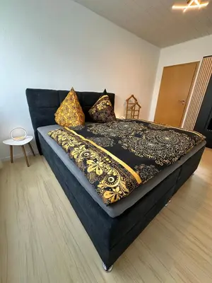 Ein Bett oder Betten in einem Zimmer der Unterkunft Gemütliches Appartement - WBS