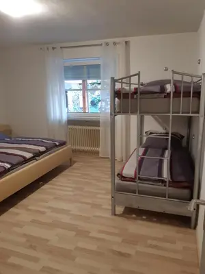 Ein Bett oder Betten in einem Zimmer der Unterkunft Ferienwohnung Leibl