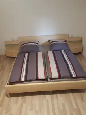 Ein Bett oder Betten in einem Zimmer der Unterkunft Ferienwohnung Leibl