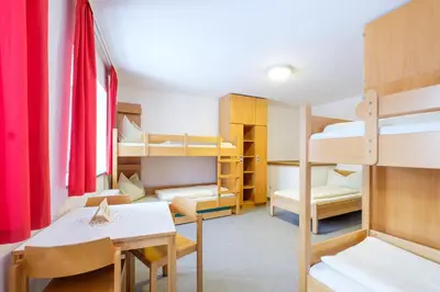 Ein Bett oder Betten in einem Zimmer der Unterkunft Jugendherberge Burg Trausnitz