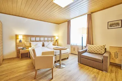Ein Bett oder Betten in einem Zimmer der Unterkunft Akzent Hotel Goldner Stern