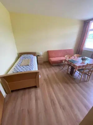 Ein Bett oder Betten in einem Zimmer der Unterkunft Ferienwohnung Goldener Drache