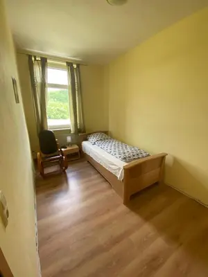 Ein Bett oder Betten in einem Zimmer der Unterkunft Ferienwohnung Goldener Drache