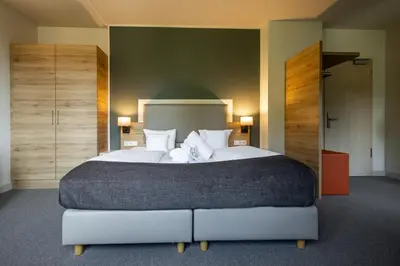 Ein Bett oder Betten in einem Zimmer der Unterkunft Hotel Stempferhof