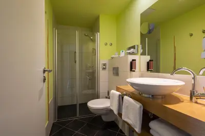 Ein Badezimmer in der Unterkunft Hotel Stempferhof