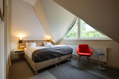 Ein Bett oder Betten in einem Zimmer der Unterkunft Hotel Stempferhof