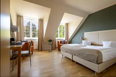 Ein Bett oder Betten in einem Zimmer der Unterkunft Hotel Stempferhof