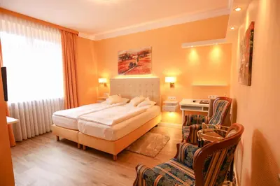Ein Bett oder Betten in einem Zimmer der Unterkunft Hotel Modena