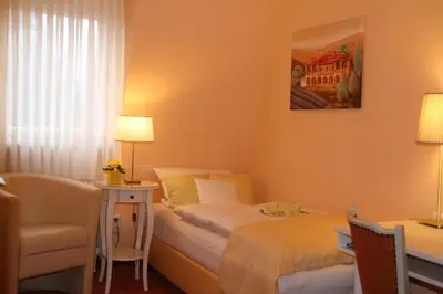 Ein Bett oder Betten in einem Zimmer der Unterkunft Hotel Modena