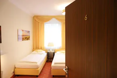 Ein Bett oder Betten in einem Zimmer der Unterkunft Hotel Modena