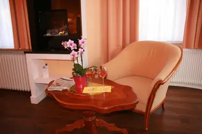 Ein Sitzbereich in der Unterkunft Hotel Modena