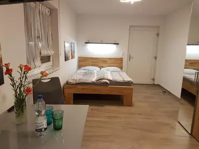 Ein Bett oder Betten in einem Zimmer der Unterkunft Casa Lago Ferienappartements Steinberg am See