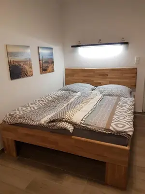 Ein Bett oder Betten in einem Zimmer der Unterkunft Casa Lago Ferienappartements Steinberg am See