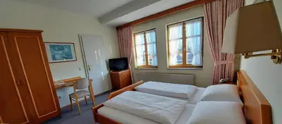 Ein Bett oder Betten in einem Zimmer der Unterkunft Gasthof Russenbräu