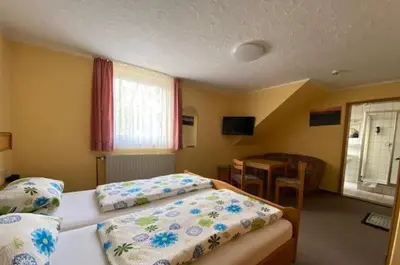 Ein Bett oder Betten in einem Zimmer der Unterkunft Landpension Heidi Machold