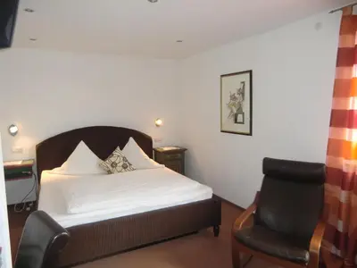 Ein Bett oder Betten in einem Zimmer der Unterkunft Hotel Zrenners GARNI