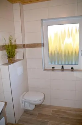 Ein Badezimmer in der Unterkunft Frankenhaus