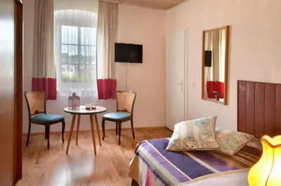 Ein Sitzbereich in der Unterkunft Gasthof Deutscher Adler und Hotel Puchtler