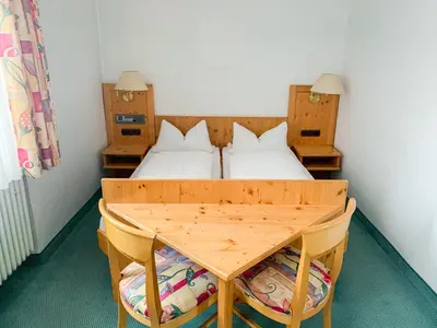 Ein Bett oder Betten in einem Zimmer der Unterkunft Landhotel Bauernschmitt