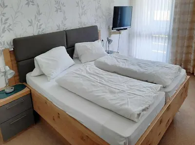 Ein Bett oder Betten in einem Zimmer der Unterkunft Café-Pension Krems