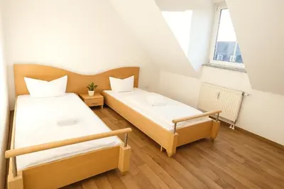 Ein Bett oder Betten in einem Zimmer der Unterkunft SUNNYHOME Monteurwohnungen und Apartments in Schwandorf