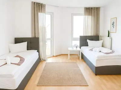 Ein Bett oder Betten in einem Zimmer der Unterkunft SUNNYHOME Monteurwohnungen und Apartments in Schwandorf