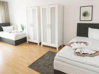 Ein Bett oder Betten in einem Zimmer der Unterkunft SUNNYHOME Monteurwohnungen und Apartments in Schwandorf