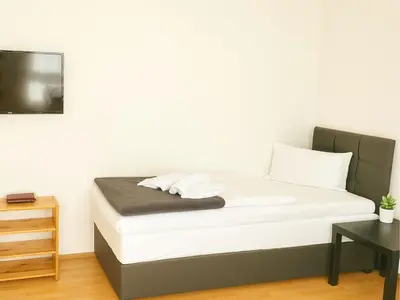 Ein Bett oder Betten in einem Zimmer der Unterkunft SUNNYHOME Monteurwohnungen und Apartments in Schwandorf