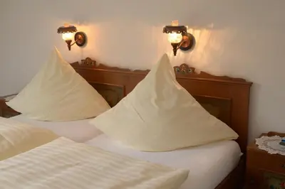 Ein Bett oder Betten in einem Zimmer der Unterkunft Pension & Metzgerei Friedrich