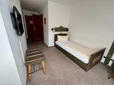 Ein Bett oder Betten in einem Zimmer der Unterkunft Pension & Metzgerei Friedrich