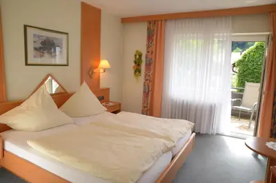 Ein Bett oder Betten in einem Zimmer der Unterkunft Pension & Metzgerei Friedrich